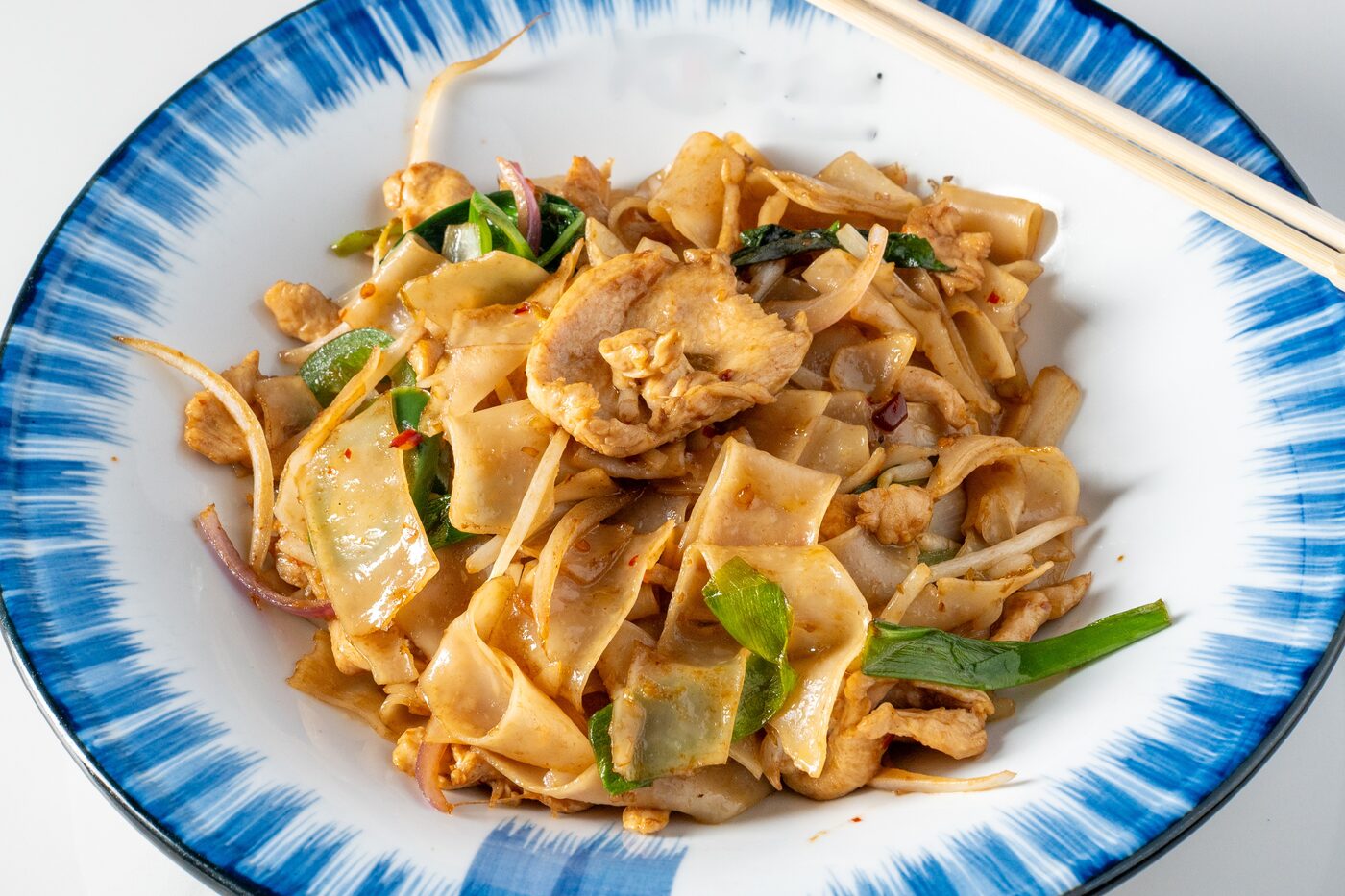 Drunken Noodles with chicken and fresh basil - East Moon Asian Bistro Centennial