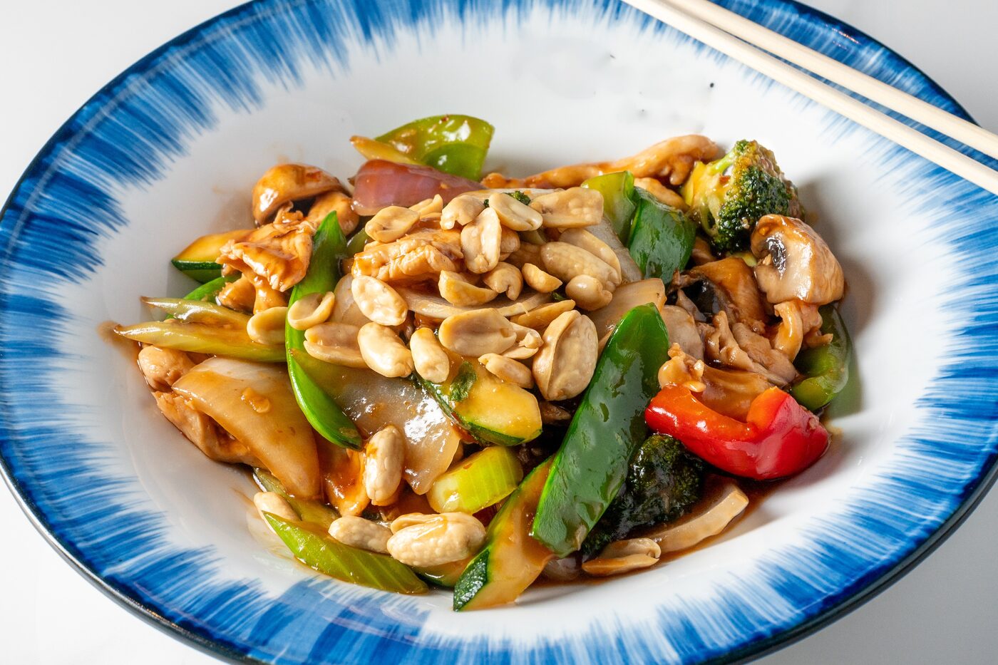 Kung Pao Chicken with peanuts, chili and vegetables - East Moon Asian Bistro Centennial CO