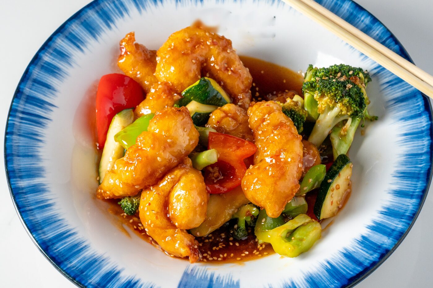 Sesame Chicken glazed in sweet sesame sauce - East Moon Asian Bistro Centennial CO