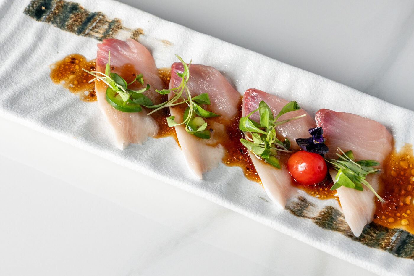 Yellowtail Jalapeno sashimi with ponzu sauce - East Moon Centennial CO