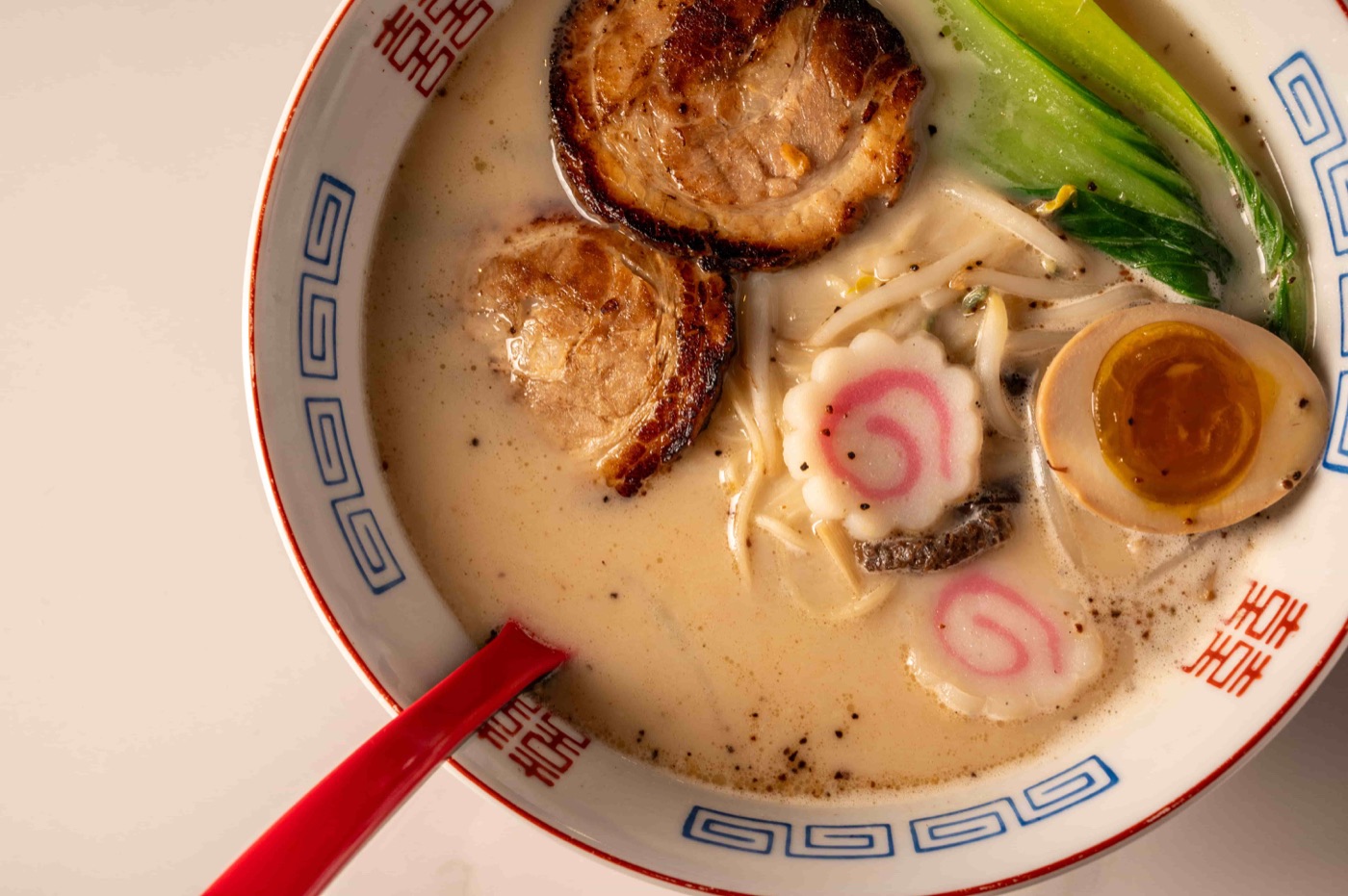 Tonkatsu ramen with marinated pork belly, soft boiled egg, bok choy and black fungus - East Moon Asian Bistro Centennial CO
