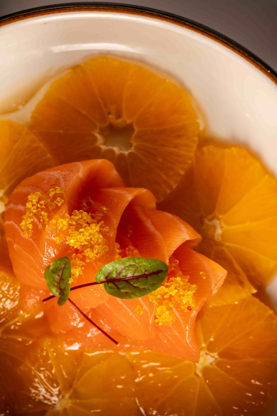 Truffle Orange Salmon sashimi with yuzu tobiko, fresh orange and ponzu sauce - East Moon Asian Bistro Centennial CO